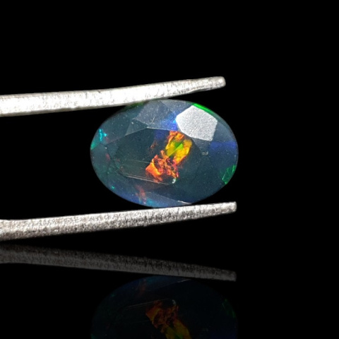 Black Ethiopian opal faceted 10x7 mm no 658 Black Ethiopian opal faceted 10x7 mm no 658