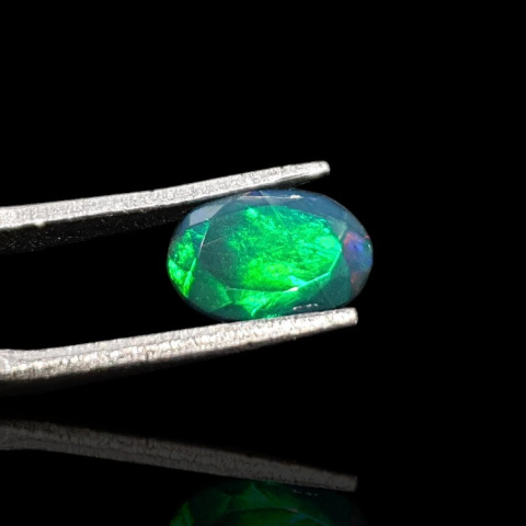 Black Ethiopian opal faceted 10x7 mm no. 669 Black Ethiopian opal faceted 10x7 mm no. 669