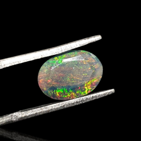Black Ethiopian opal faceted 10x8 mm no. 649 Black Ethiopian opal faceted 10x8 mm no. 649