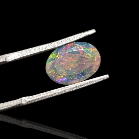 Black Ethiopian opal faceted 10x8 mm no. 649 Black Ethiopian opal faceted 10x8 mm no. 649