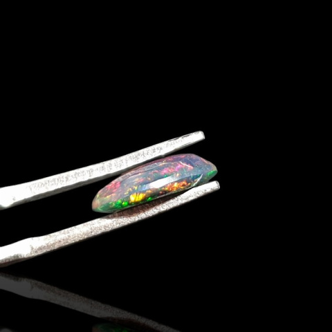 Black Ethiopian opal faceted 10x8 mm no. 649 Black Ethiopian opal faceted 10x8 mm no. 649