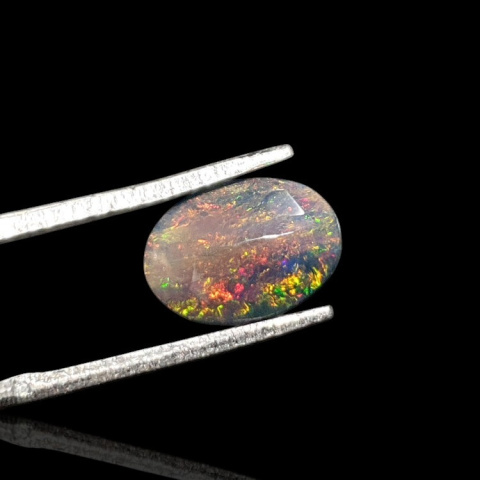 Black Ethiopian opal faceted 10x8 mm no. 649 Black Ethiopian opal faceted 10x8 mm no. 649