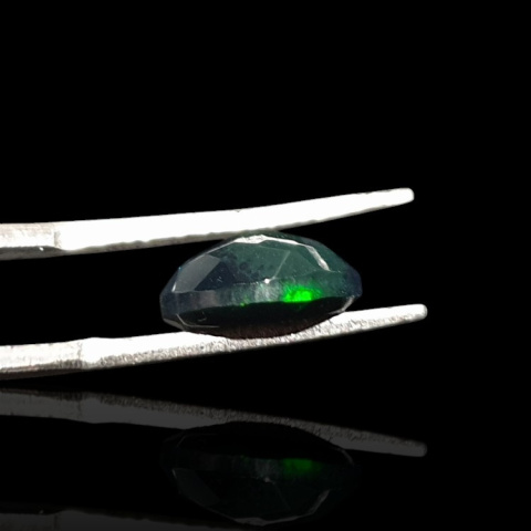 Black Ethiopian opal faceted 10x8 mm no. 662 Black Ethiopian opal faceted 10x8 mm no. 662