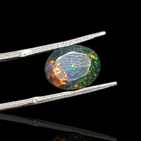 Black Ethiopian opal faceted 11x9 mm no 637 Black Ethiopian opal faceted 11x9 mm no 637