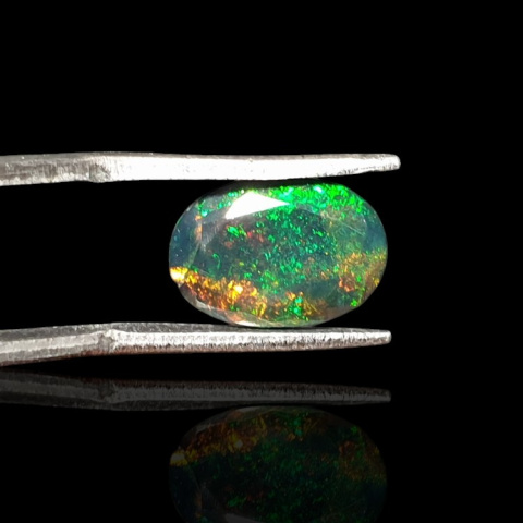 Black Ethiopian opal faceted 12x8 mm no. 630 Black Ethiopian opal faceted 12x8 mm no. 630