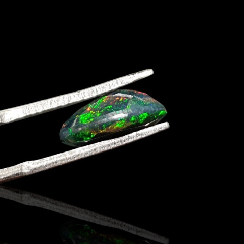 Black Ethiopian opal faceted 12x8 mm no. 630 Black Ethiopian opal faceted 12x8 mm no. 630