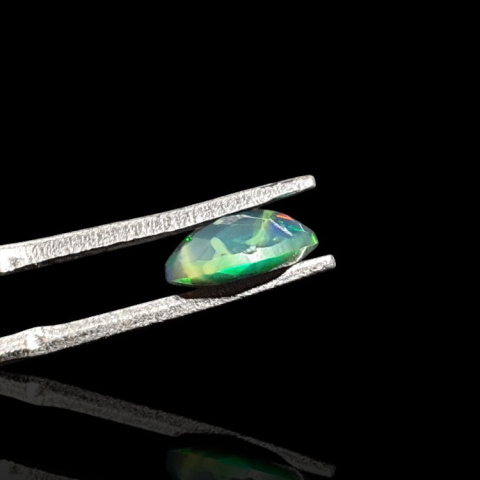 Black Ethiopian opal faceted 8x6 mm no. 701 Black Ethiopian opal faceted 8x6 mm no. 701