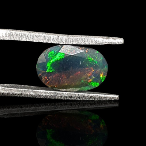 Black Ethiopian opal faceted 9x6 mm no. 672 Black Ethiopian opal faceted 9x6 mm no. 672
