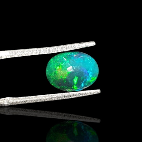 Black Ethiopian opal faceted 9x7 mm no. 671 Black Ethiopian opal faceted 9x7 mm no. 671