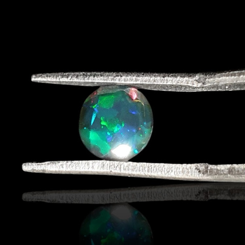 Black Ethiopian opal faceted fi 7 mm no 713 Black Ethiopian opal faceted fi 7 mm no 713