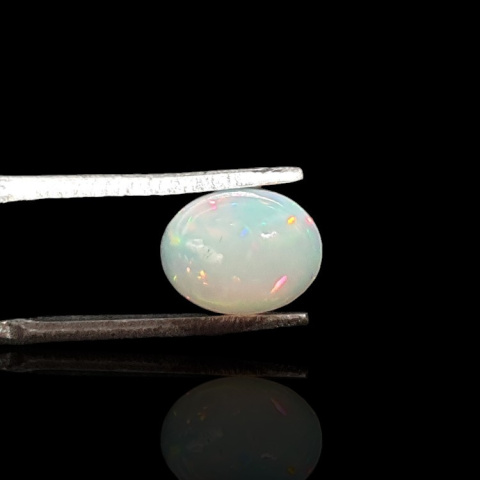 Opal from Ethiopia cabochon 9x7 mm no 729 Opal from Ethiopia cabochon 9x7 mm no 729