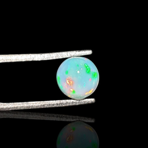 Opal from Ethiopia cabochon fi 7 mm no 791 Opal from Ethiopia cabochon fi 7 mm no 791