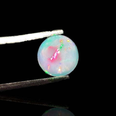 Opal from Ethiopia cabochon fi 7 mm no 794 Opal from Ethiopia cabochon fi 7 mm no 794