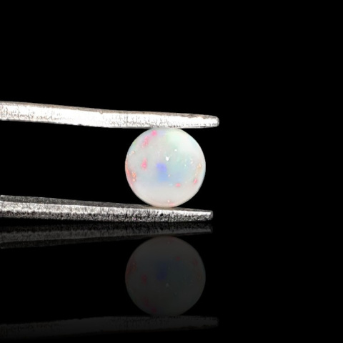 Opal from Ethiopia cabochon fi 6 mm no. 817 Opal from Ethiopia cabochon fi 6 mm no. 817