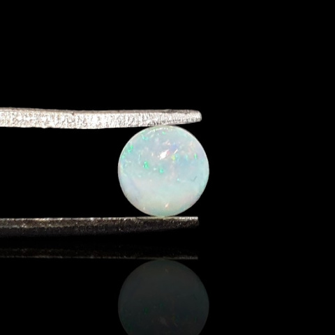 Opal from Ethiopia cabochon dia. 6 mm no 829 Opal from Ethiopia cabochon dia. 6 mm no 829