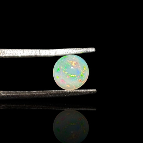 Opal from Ethiopia cabochon fi 6 mm no. 831 Opal from Ethiopia cabochon fi 6 mm no. 831