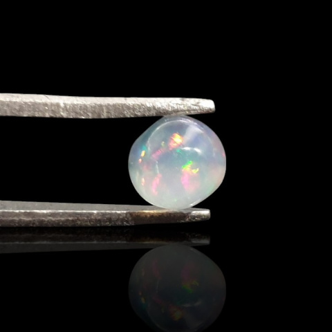 Opal from Ethiopia cabochon fi 6 mm no 837 Opal from Ethiopia cabochon fi 6 mm no 837