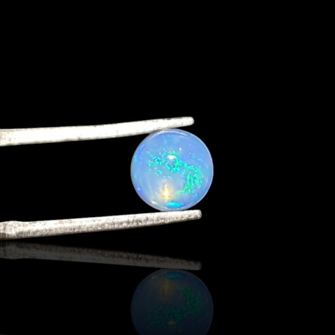 Opal from Ethiopia cabochon fi 7 mm no 797 Opal from Ethiopia cabochon fi 7 mm no 797