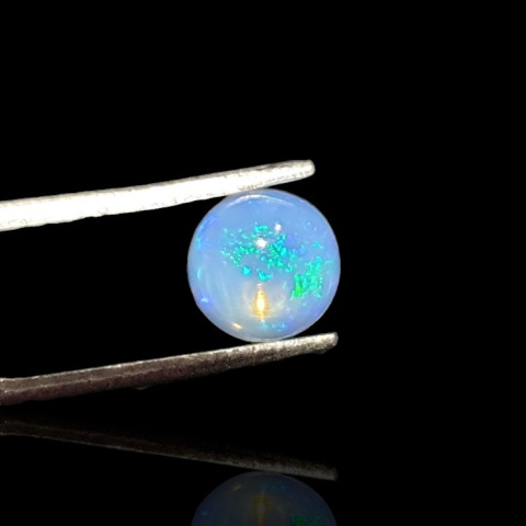 Opal from Ethiopia cabochon fi 7 mm no 797 Opal from Ethiopia cabochon fi 7 mm no 797