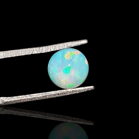 Opal from Ethiopia cabochon fi 7 mm no 801 Opal from Ethiopia cabochon fi 7 mm no 801
