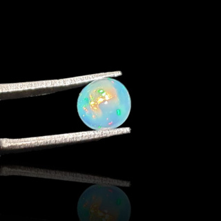 Opal from Ethiopia cabochon fi 7 mm no 802
