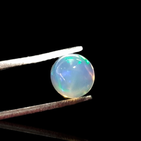 Opal from Ethiopia cabochon fi 7 mm no. 809 Opal from Ethiopia cabochon fi 7 mm no. 809