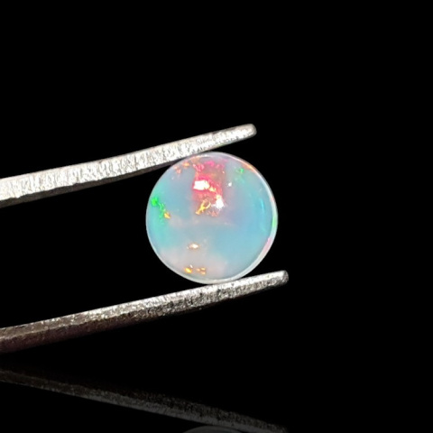 Opal from Ethiopia cabochon fi 7 mm no. 810 Opal from Ethiopia cabochon fi 7 mm no. 810