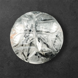Quartz with tourmaline cabochon carving fi 21 mm no. 22