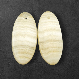 Żółty aragonit para kaboszonów z dziurką 25x12 mm nr P951