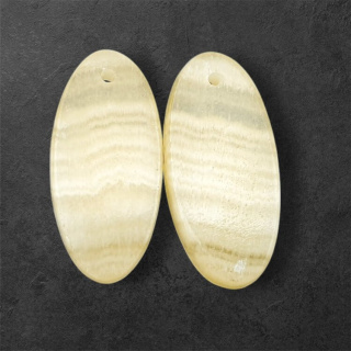 Żółty aragonit para kaboszonów z dziurką 25x12 mm nr P966