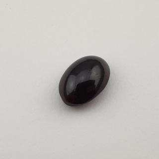 Granat gwiaździsty kaboszon 12x8 mm nr 52