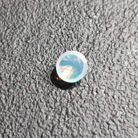 Opal from Ethiopia cabochon dia. 5 mm no 487 Opal from Ethiopia cabochon dia. 5 mm no 487