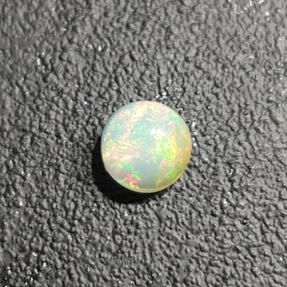 Opal from Ethiopia cabochon fi 7 mm no 412