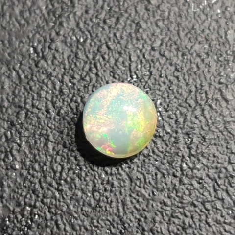 Opal from Ethiopia cabochon fi 7 mm no 412 Opal from Ethiopia cabochon fi 7 mm no 412