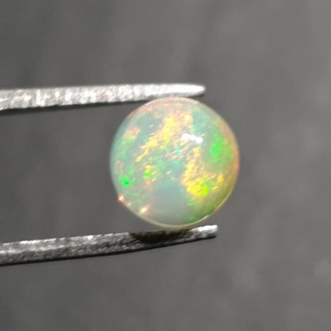 Opal from Ethiopia cabochon fi 7 mm no 412 Opal from Ethiopia cabochon fi 7 mm no 412