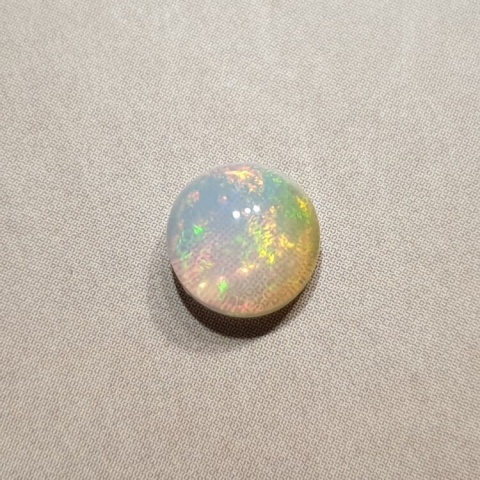 Opal from Ethiopia cabochon fi 7 mm no 412 Opal from Ethiopia cabochon fi 7 mm no 412