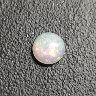 Opal from Ethiopia cabochon fi 7 mm no 413