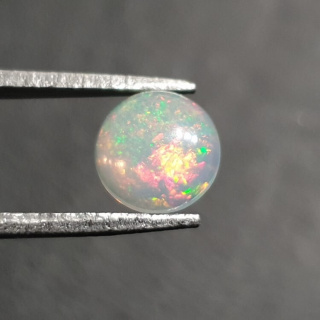 Opal from Ethiopia cabochon fi 7 mm no 413