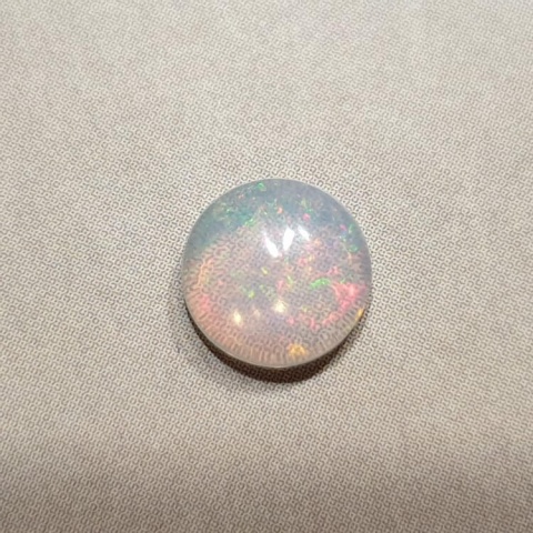 Opal from Ethiopia cabochon dia. 7 mm no 413 Opal from Ethiopia cabochon dia. 7 mm no 413