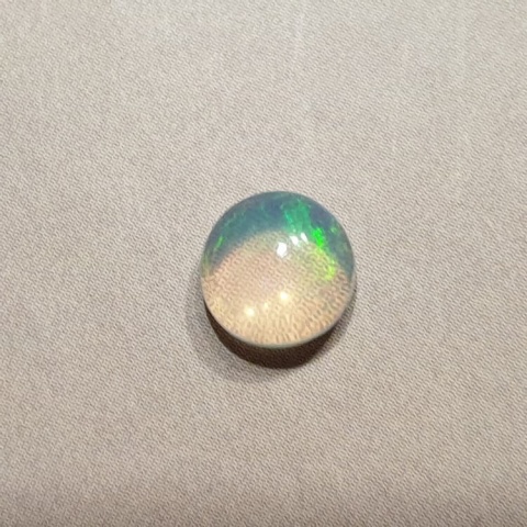 Opal z Etiopii kaboszon fi 7 mm nr 416 Opal z Etiopii kaboszon fi 7 mm nr 416