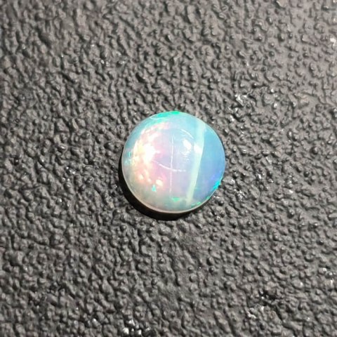 Opal from Ethiopia cabochon fi 7 mm no 420 Opal from Ethiopia cabochon fi 7 mm no 420
