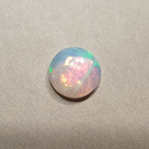 Opal from Ethiopia cabochon fi 7 mm no 420 Opal from Ethiopia cabochon fi 7 mm no 420