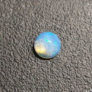 Opal from Ethiopia cabochon fi 7 mm no 424