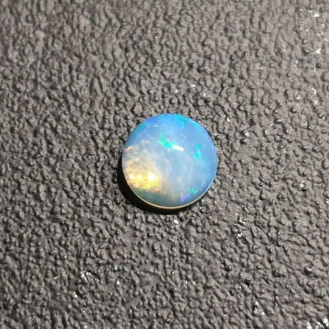 Opal from Ethiopia cabochon fi 7 mm no 424 Opal from Ethiopia cabochon fi 7 mm no 424