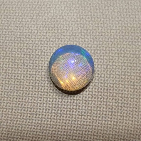 Opal from Ethiopia cabochon fi 7 mm no 424 Opal from Ethiopia cabochon fi 7 mm no 424