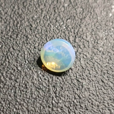 Opal from Ethiopia cabochon fi 7 mm no 424 Opal from Ethiopia cabochon fi 7 mm no 424