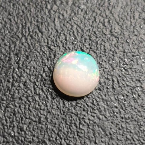 Opal from Ethiopia cabochon fi 7 mm no 425 Opal from Ethiopia cabochon fi 7 mm no 425