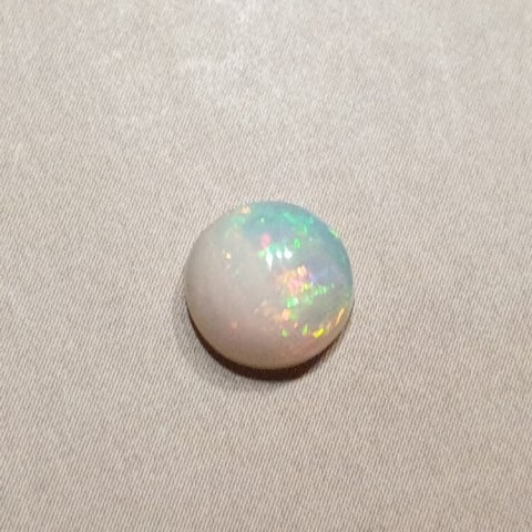 Opal from Ethiopia cabochon fi 7 mm no 425 Opal from Ethiopia cabochon fi 7 mm no 425