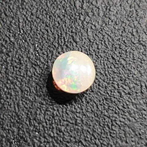 Opal from Ethiopia cabochon fi 7 mm no 425 Opal from Ethiopia cabochon fi 7 mm no 425