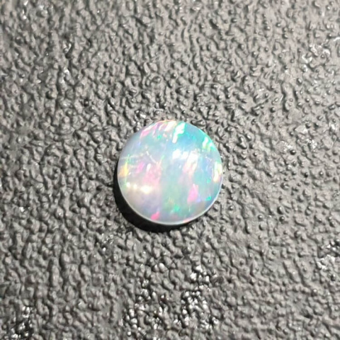 Opal from Ethiopia cabochon fi 7 mm no 426 Opal from Ethiopia cabochon fi 7 mm no 426